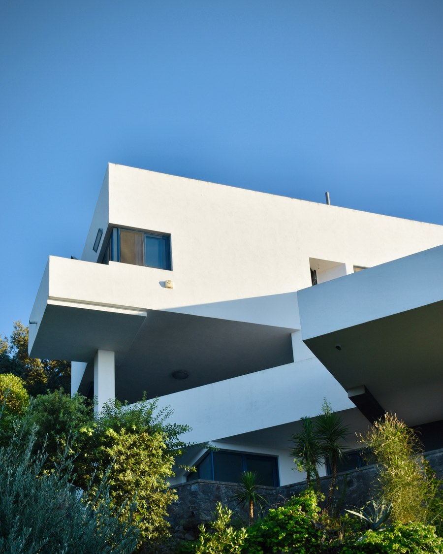 Modern cantilevered villa surrounded by greenery in Positano